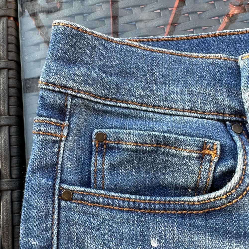 Ann Taylor denim pants with black lace detailing on the cuffs